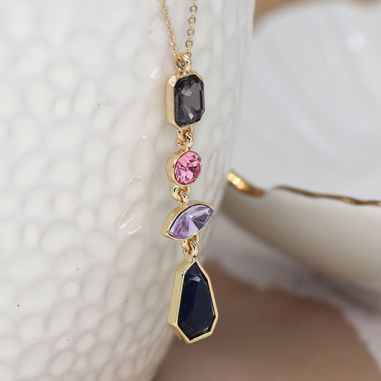 Faux gold plated fine chain necklace with crystal drops in shades of pink and blue.