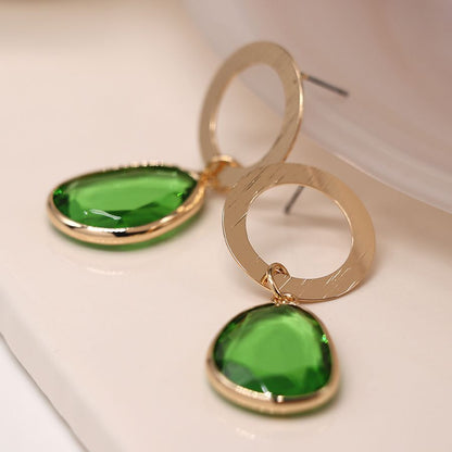 Golden scratched circle and green drop earrings