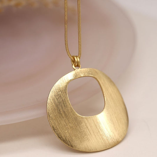Long faux gold plated disc pendant